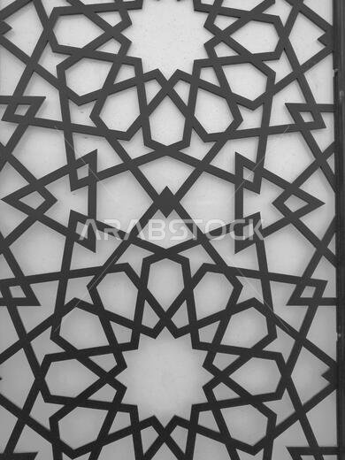 خلفية بنمط أرابيسك حديث. يرتبط هذا التصميم الجميل بالحضارة الإسلامية القديمة، ويتميز بأشكال هندسية متكررة.