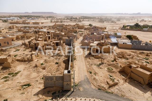 View of the small village Raghba with the abandoned mud houses in the middle of the desert in Saudi Arabia