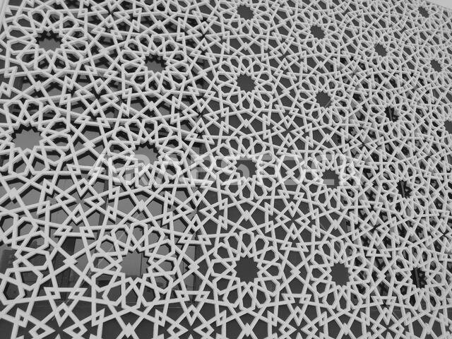 Modern Arabesque pattern background. Associated with ancient Islamic civilization the beautiful design features repetitive geometric forms or shapes.