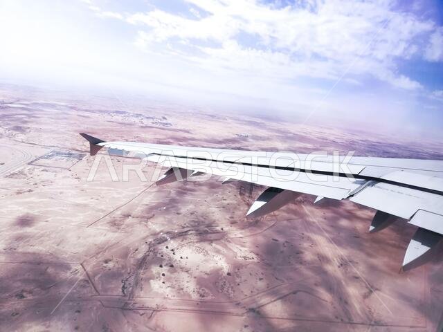 Booking airline Ticket - Airplane window seat showing clouds and wing جناح طائرة - حجز رحلة طيران سياحة سفر مطار Booking airline Ticket - Airplane window seat showing clouds and wing جناح طائرة - حجز رحلة طيران سياحة سفر مطار