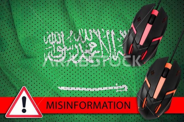 Saudi Arabia flag and two computer mouses. Misinformation during Coronavirus or pandemic 2019-nCov virus concept
