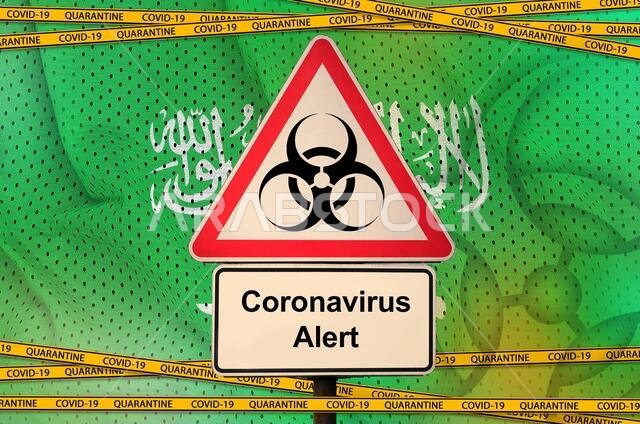 Saudi Arabia flag and Covid-19 biohazard symbol with quarantine orange tape. Coronavirus or pandemic 2019-nCov virus concept