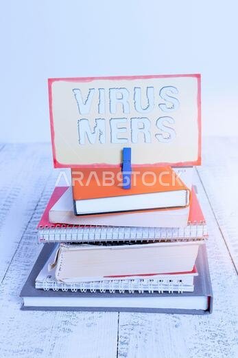 Handwriting text writing Virus Mers. Conceptual photo viral respiratory illness that first reported in Saudi Arabia pile stacked books notebook pin cl