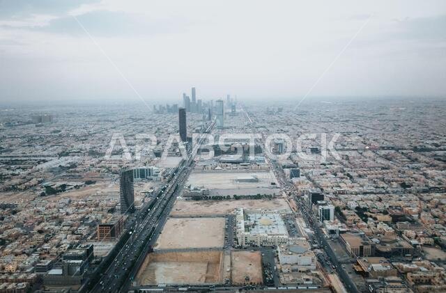 Skyline view at Riyadh in direction of King Abdullah Financial District from the top of Riyadh Kingdom tower in foggy cloudy day
