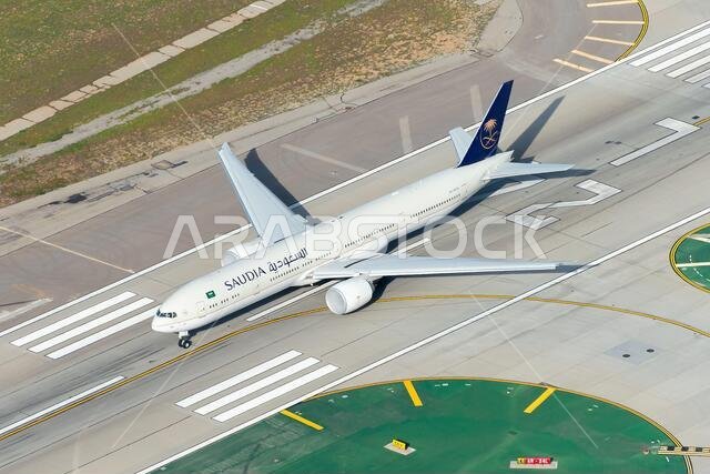 Saudi Arabian Airlines Boeing 777-300 departing Los Angeles International Airport. 777 airplane HZ-AK40 aerial view. Also know as Saudia Airlines.