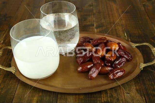 Conceptual photo of Ramadan food:dates palm, milk and water Conceptual photo of Ramadan food:dates palm, milk and water