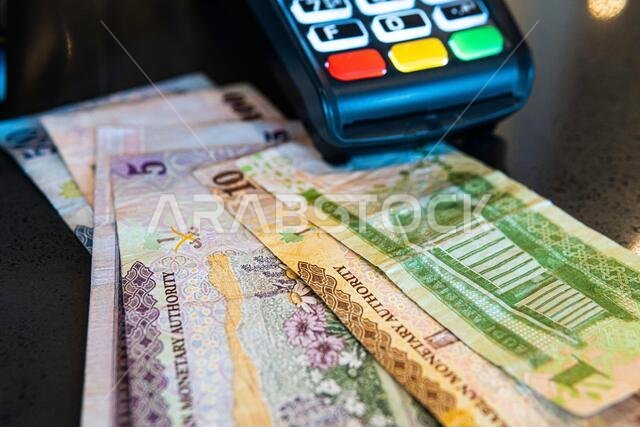 Credit Card Machine with Saudi Riyal Banknotes