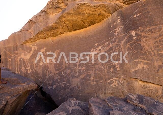 Petroglyphs on a rock depicting hunters, Najran Province, Thar, Saudi Arabia