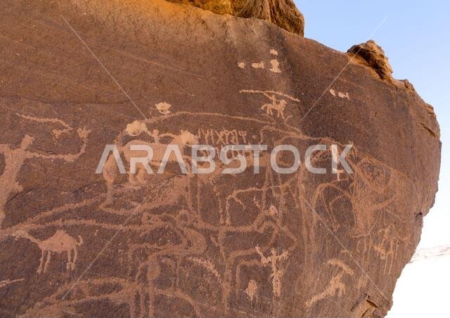 Petroglyphs on a rock depicting hunters, Najran Province, Thar, Saudi Arabia