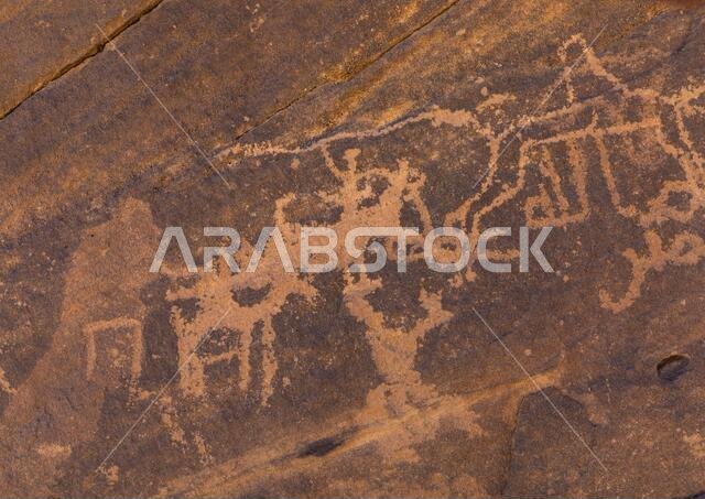 Petroglyphs on a rock depicting hunters, Najran Province, Najd Khayran, Saudi Arabia