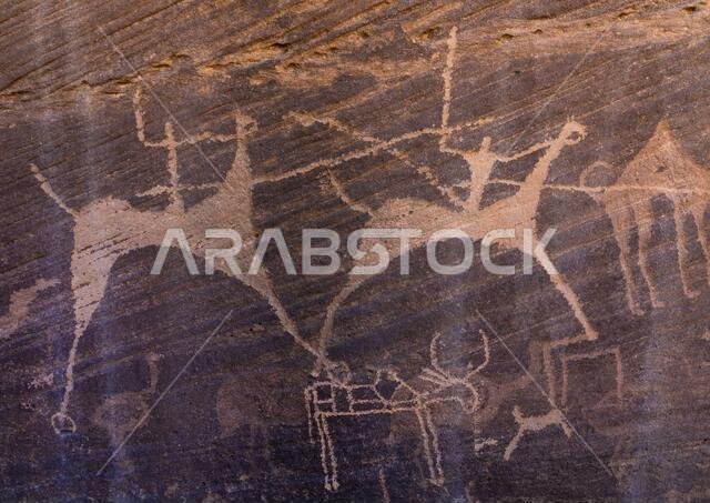 Petroglyphs on a rock depicting men hunting on horses, Najran Province, Minshaf, Saudi Arabia
