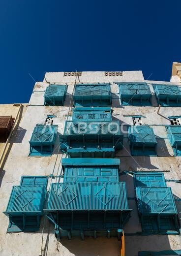 Historic house with blue wooden mashrabiyas in al-Balad quarter, Mecca province, Jeddah, Saudi Arabia