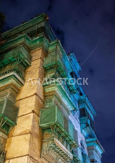 Historic house with wooden mashrabiyas in al-Balad quarter at night, Mecca province, Jeddah, Saudi Arabia