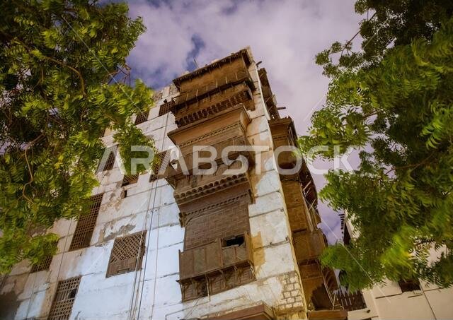 Historic house with wooden mashrabiyas in al-Balad quarter at night, Mecca province, Jeddah, Saudi Arabia