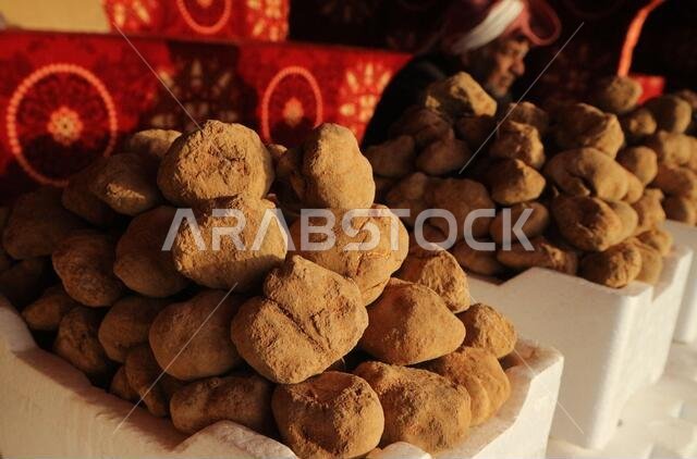 Kuwait City/Kuwait - January 10, 2020: Arab man in traditional head-dress selling desert truffles