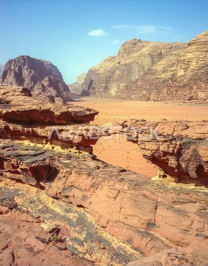 Jordan. Colourful desert mountain landscapes at the rock arch of Al Kharza at the UNESCO World Heritage Site of Wadi Rum near the port of Aqaba in southern Jordan