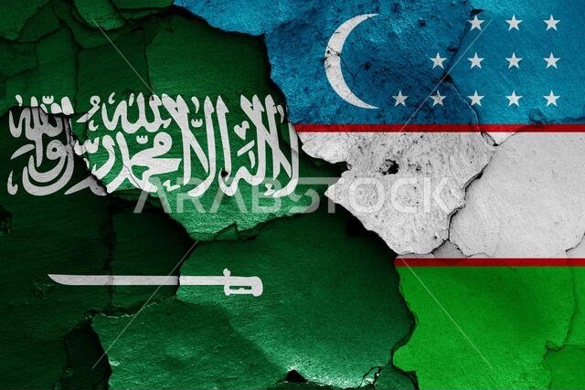 flags of Saudi Arabia and Uzbekistan painted on cracked wall