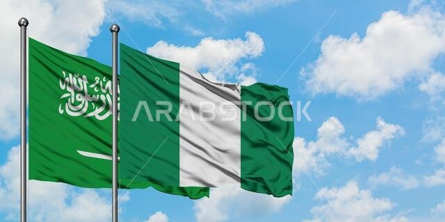 Saudi Arabia and Nigeria flag waving in the wind against white cloudy blue sky together. Diplomacy concept, international relations.
