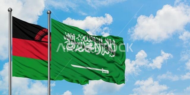 Malawi and Saudi Arabia flag waving in the wind against white cloudy blue sky together. Diplomacy concept, international relations.