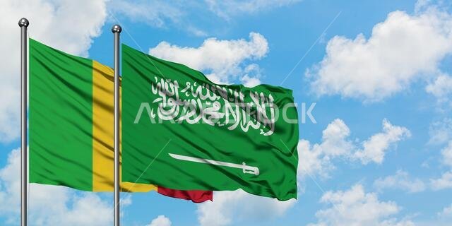 Mali and Saudi Arabia flag waving in the wind against white cloudy blue sky together. Diplomacy concept, international relations.