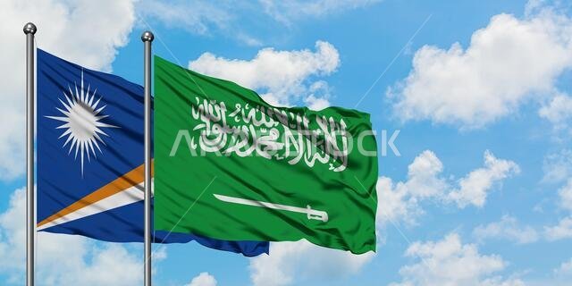 Marshall Islands and Saudi Arabia flag waving in the wind against white cloudy blue sky together. Diplomacy concept, international relations.