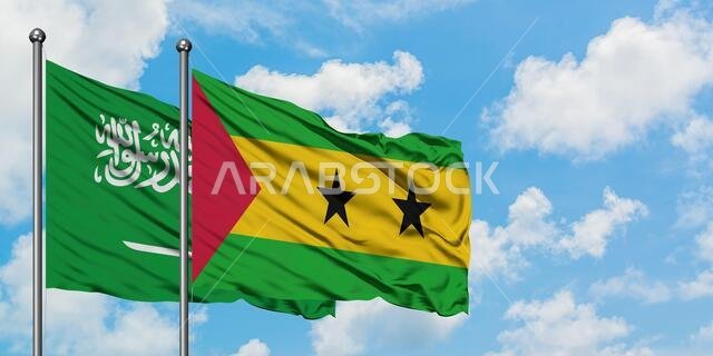 Saudi Arabia and Sao Tome And Principe flag waving in the wind against white cloudy blue sky together. Diplomacy concept, international relations.