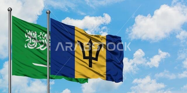 Saudi Arabia and Barbados flag waving in the wind against white cloudy blue sky together. Diplomacy concept, international relations.