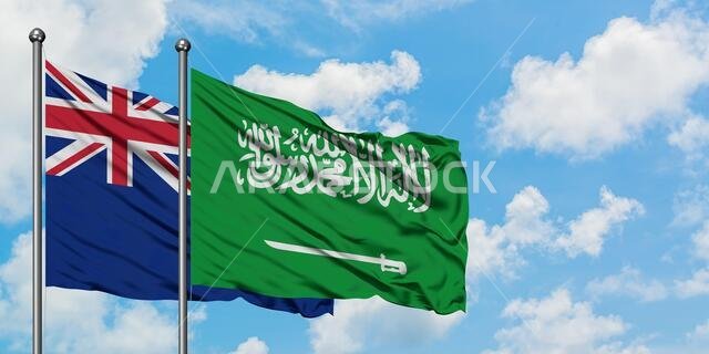 New Zealand and Saudi Arabia flag waving in the wind against white cloudy blue sky together. Diplomacy concept, international relations.