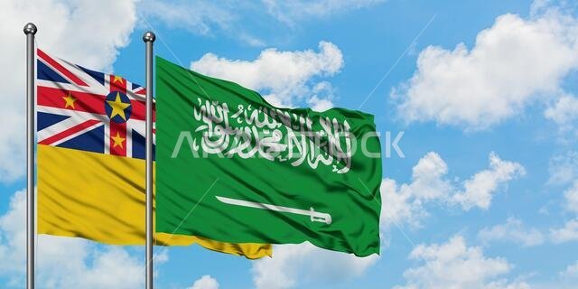 Niue and Saudi Arabia flag waving in the wind against white cloudy blue sky together. Diplomacy concept, international relations.