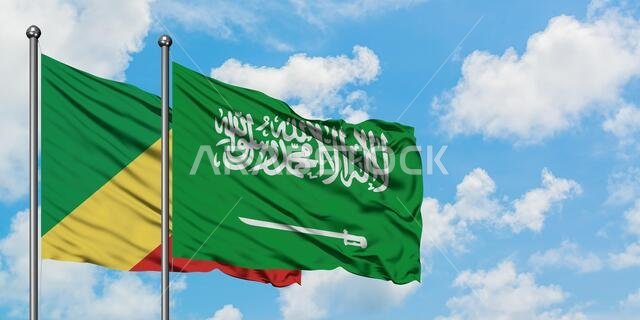 Republic Of The Congo and Saudi Arabia flag waving in the wind against white cloudy blue sky together. Diplomacy concept, international relations.