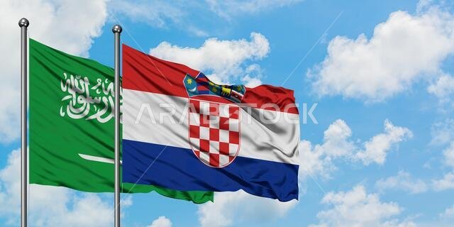 Saudi Arabia and Croatia flag waving in the wind against white cloudy blue sky together. Diplomacy concept, international relations.