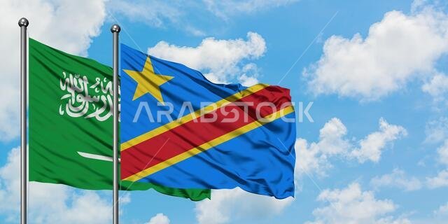 Saudi Arabia and Congo flag waving in the wind against white cloudy blue sky together. Diplomacy concept, international relations.