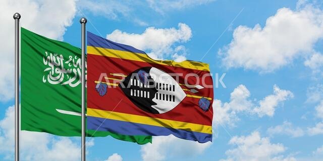 Saudi Arabia and Swaziland flag waving in the wind against white cloudy blue sky together. Diplomacy concept, international relations.