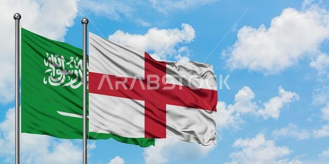 يرفرف علم المملكة العربية السعودية وعلم إنجلترا معاً في مهب الريح أمام سماء زرقاء صافية تتلألأ فيها الغيوم البيضاء. مفهوم الدبلوماسية، العلاقات الدولية. يرفرف علم المملكة العربية السعودية وعلم إنجلترا معاً في مهب الريح أمام سماء زرقاء صافية تتلألأ فيها الغيوم البيضاء. مفهوم الدبلوماسية، العلاقات الدولية.
