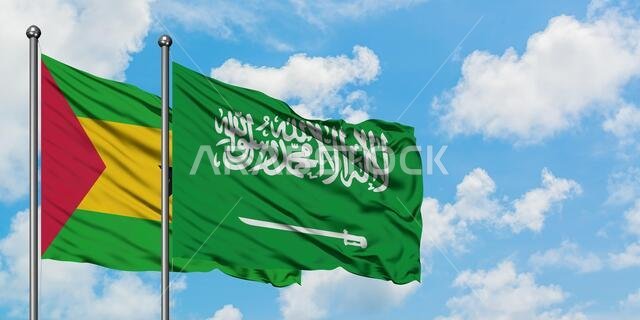 Sao Tome And Principe and Saudi Arabia flag waving in the wind against white cloudy blue sky together. Diplomacy concept, international relations.