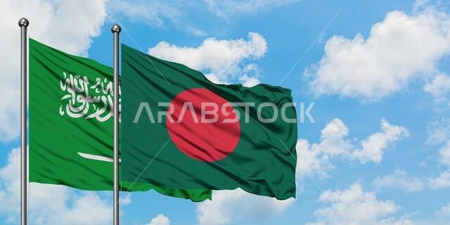 Saudi Arabia and Bangladesh flag waving in the wind against white cloudy blue sky together. Diplomacy concept, international relations. Saudi Arabia and Bangladesh flag waving in the wind against white cloudy blue sky together. Diplomacy concept, international relations.