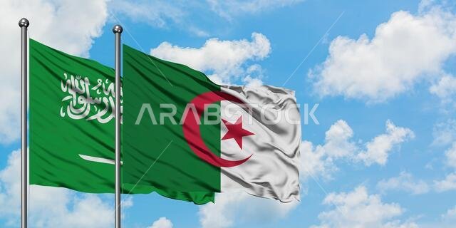 Saudi Arabia and Algeria flag waving in the wind against white cloudy blue sky together. Diplomacy concept, international relations.