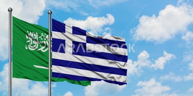 Saudi Arabia and Greece flag waving in the wind against white cloudy blue sky together. Diplomacy concept, international relations.