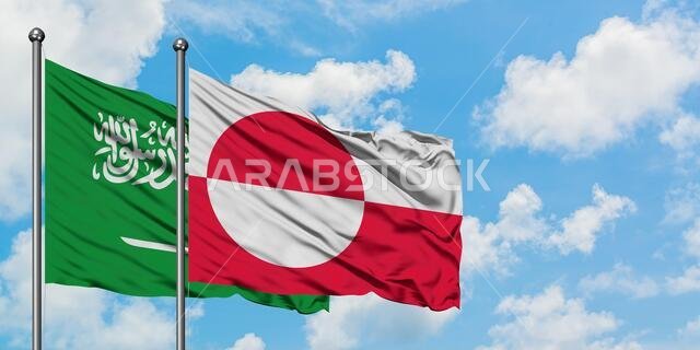 Saudi Arabia and Greenland flag waving in the wind against white cloudy blue sky together. Diplomacy concept, international relations.