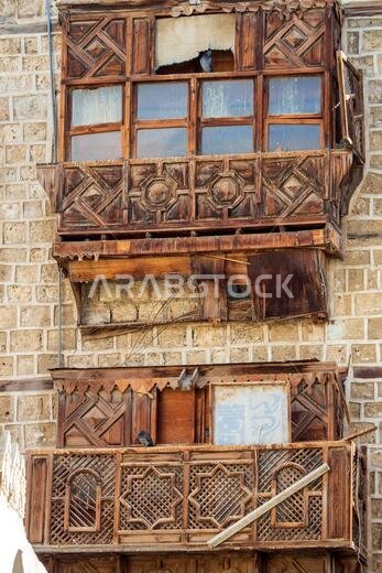 Exterior view of dilapidated traditional residential buildings at the historic district, Al Balad, old city of Jeddah, KSA, Saudi Arabia