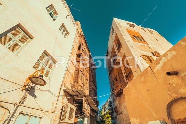 Exterior view of dilapidated traditional residential buildings at the historic district, Al Balad, old city of Jeddah, Saudi Arabia