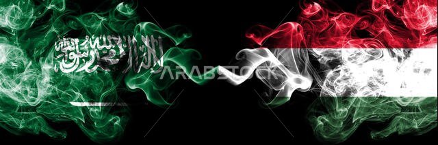 Saudi Arabia Kingdom vs Hungary, Hungarian smoky mystic flags placed side by side. Thick colored silky smoke flags of Arabic, Arabian and Hungary, Hun