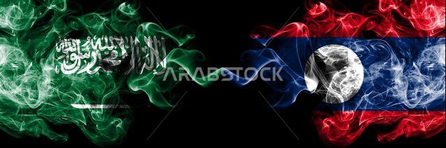 Saudi Arabia Kingdom vs Laos smoky mystic flags placed side by side. Thick colored silky smoke flags of Arabic, Arabian and Laos