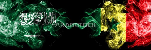 Saudi Arabia Kingdom vs Senegal, Senegalese smoky mystic flags placed side by side. Thick colored silky smoke flags of Arabic, Arabian and Senegal, Se