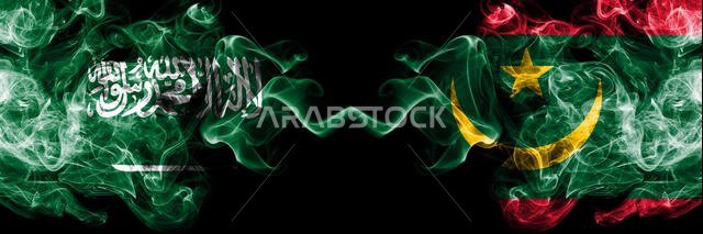 Saudi Arabia Kingdom vs Mauritania, Mauritanian smoky mystic flags placed side by side. Thick colored silky smoke flags of Arabic, Arabian and Maurita