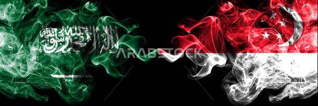 Saudi Arabia Kingdom vs Singapore, Singaporean smoky mystic flags placed side by side. Thick colored silky smoke flags of Arabic, Arabian and Singapor