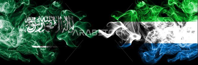 Saudi Arabia Kingdom vs Sierra Leone smoky mystic flags placed side by side. Thick colored silky smoke flags of Arabic, Arabian and Sierra Leone