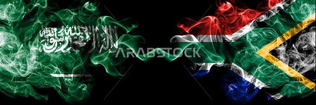 Saudi Arabia Kingdom vs South Africa, African smoky mystic flags placed side by side. Thick colored silky smoke flags of Arabic, Arabian and South Afr
