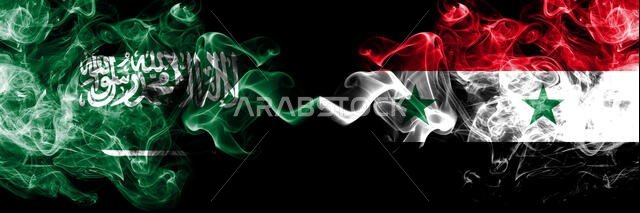 Saudi Arabia Kingdom vs Syria, Syrian smoky mystic flags placed side by side. Thick colored silky smoke flags of Arabic, Arabian and Syria, Syrian