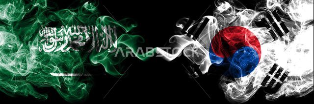 Saudi Arabia Kingdom vs South Korea, Korean smoky mystic flags placed side by side. Thick colored silky smoke flags of Arabic, Arabian and South Korea